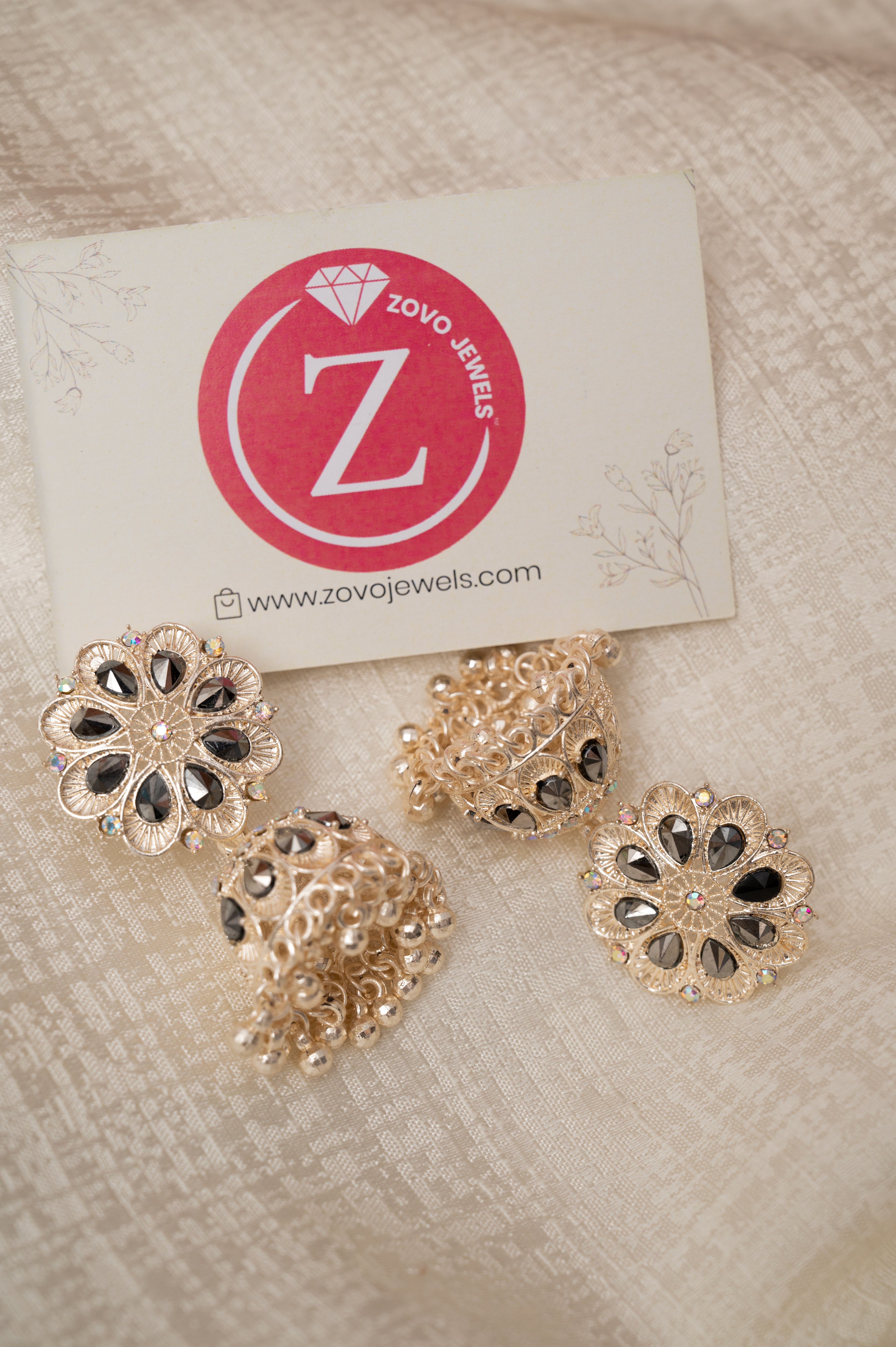Rose Gold With Black Stone Jhumka Earrings