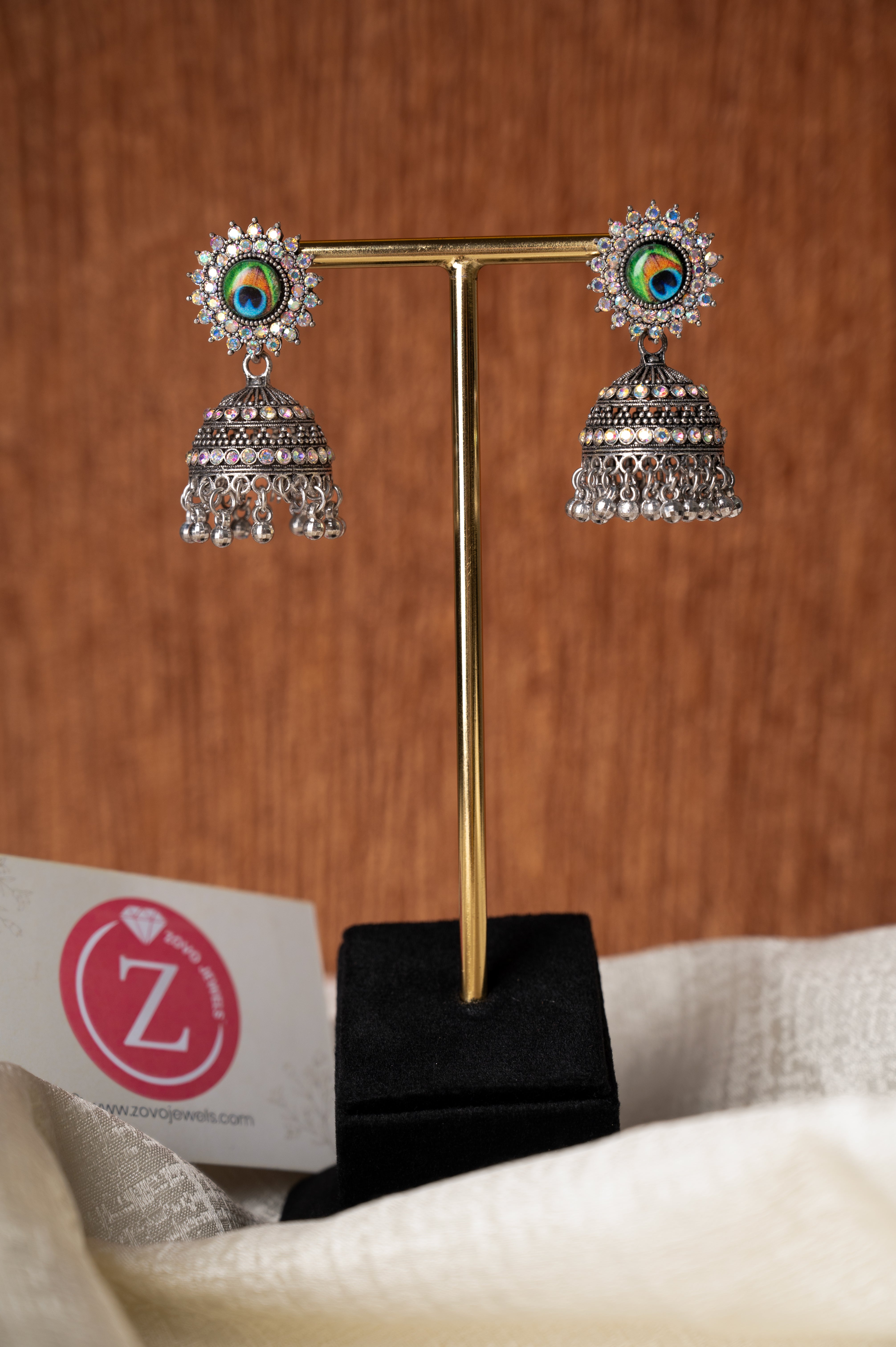 Jhumka Earrings with Peacock Feather Stud Design