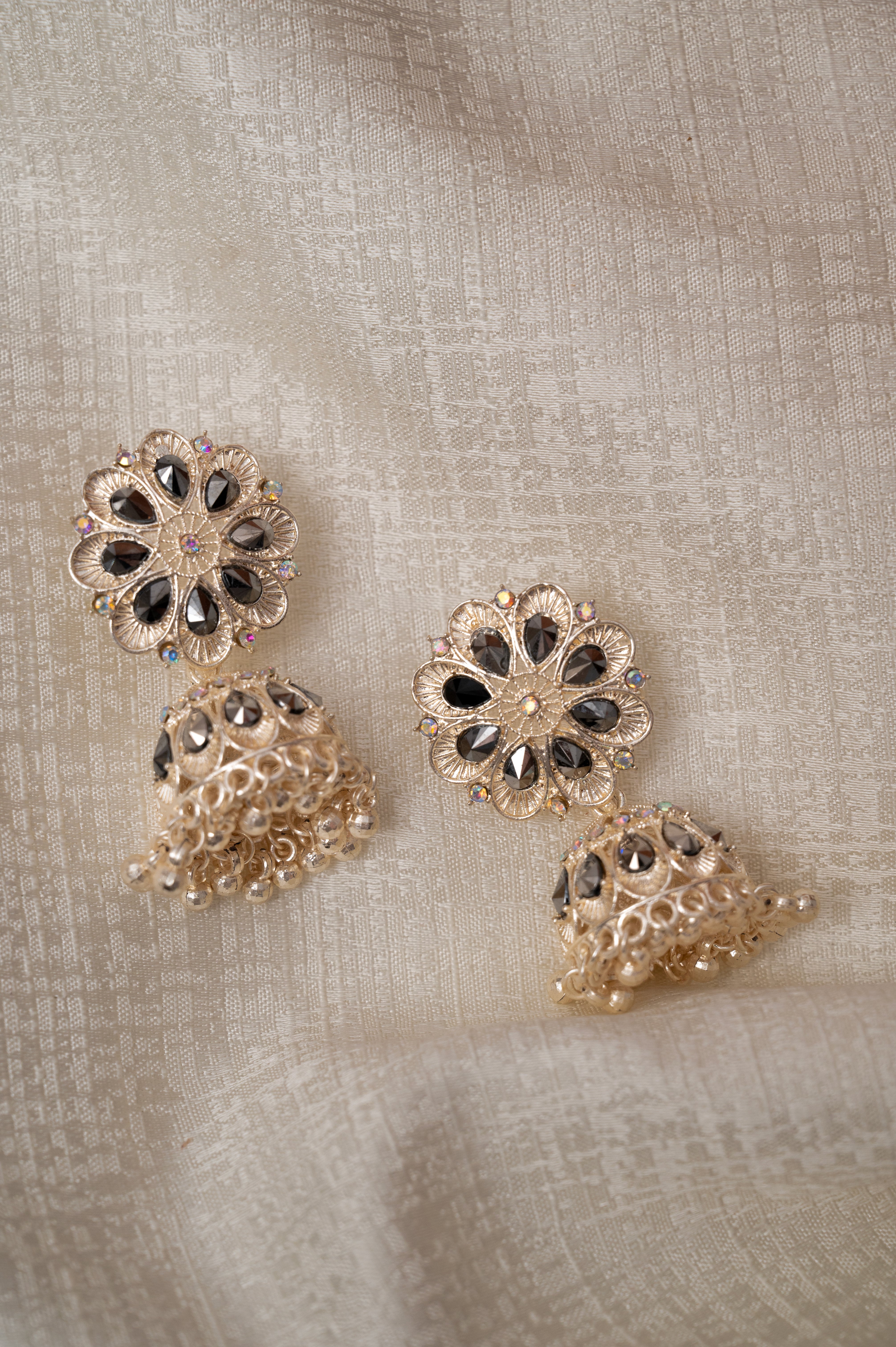 Rose Gold With Black Stone Jhumka Earrings
