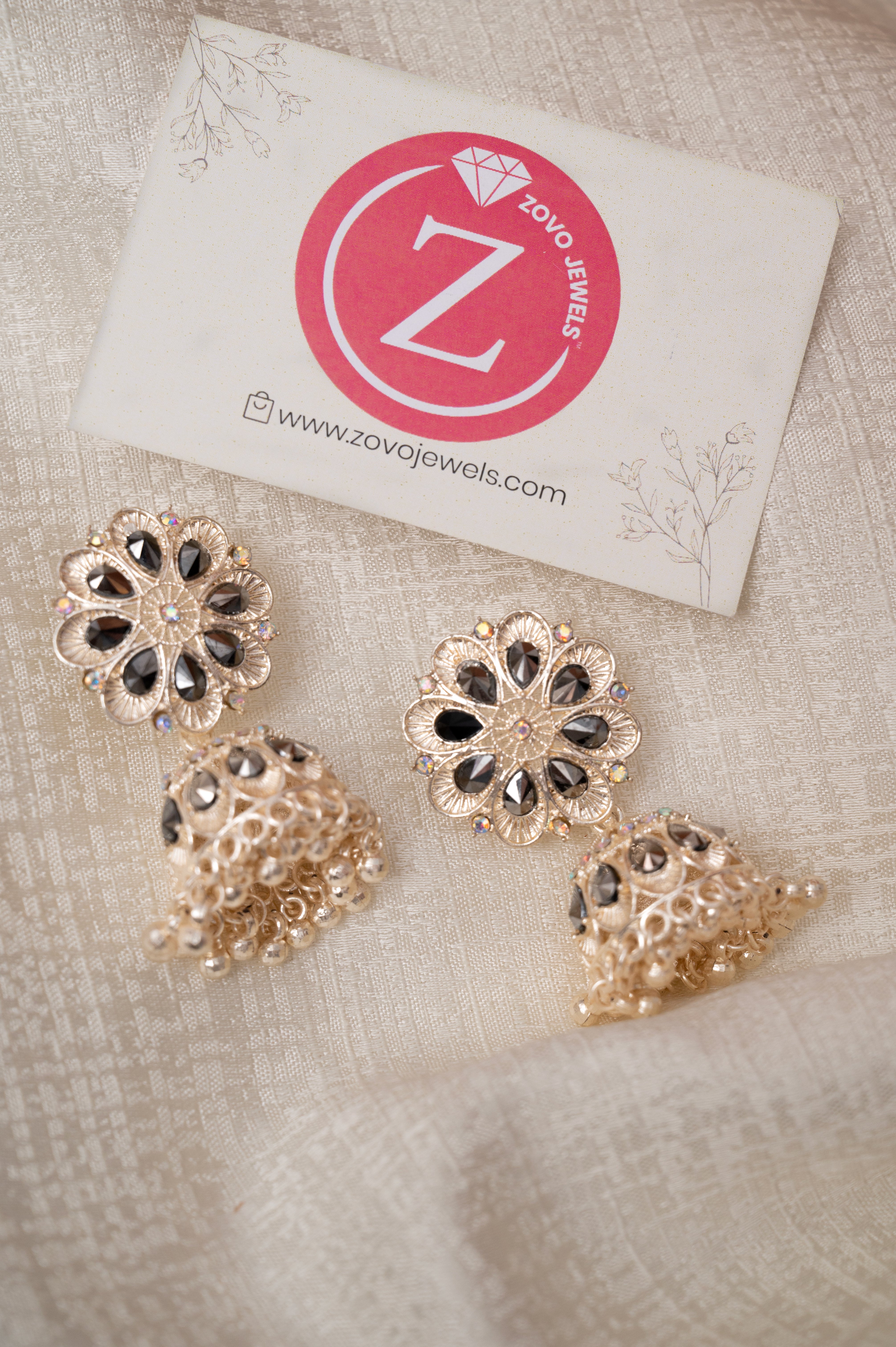Rose Gold With Black Stone Jhumka Earrings